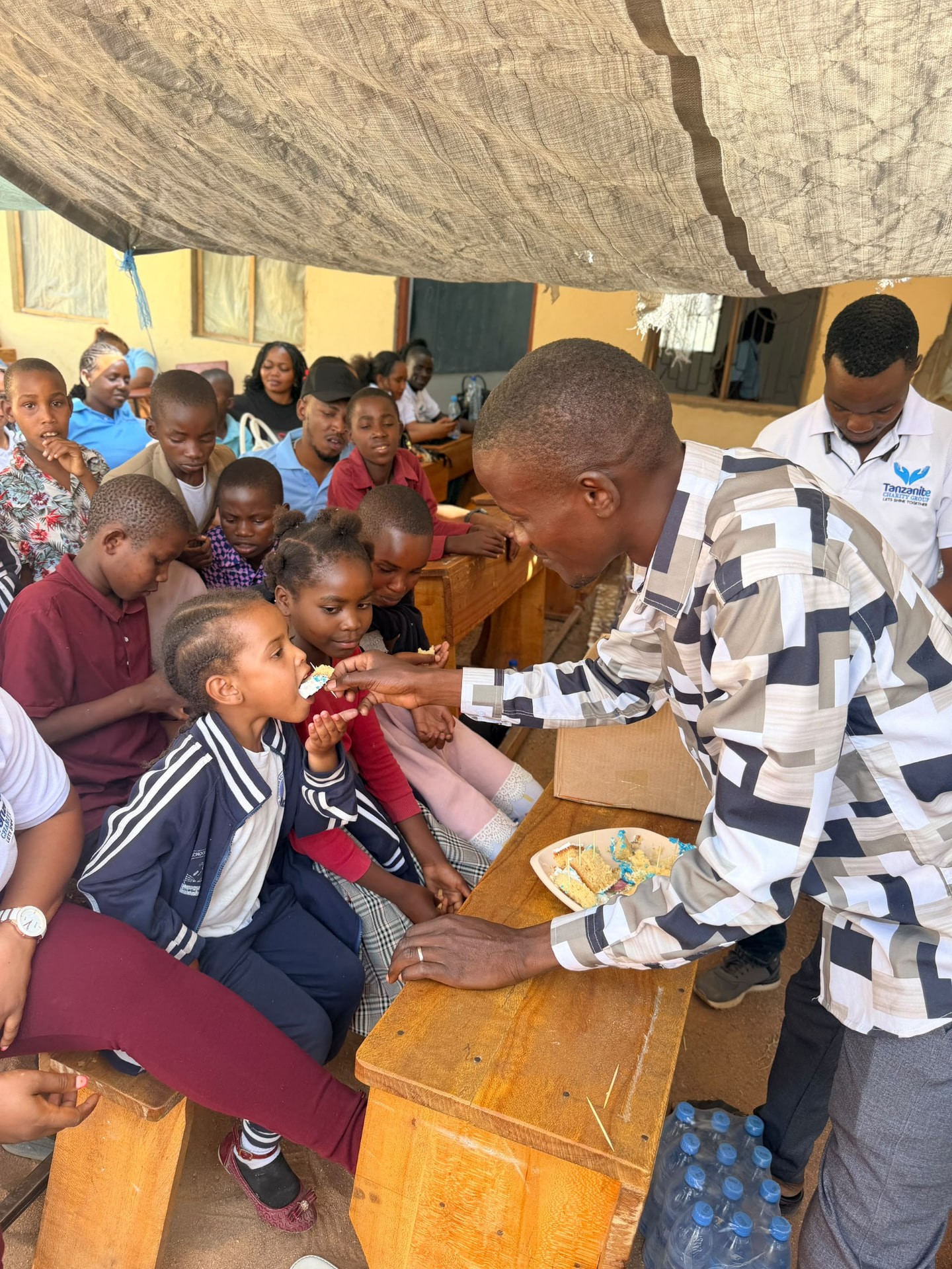 Sharing Cake with Students During the Youth Visit