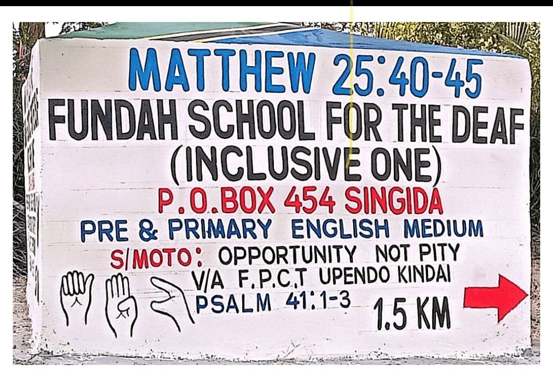 Roadside School Sign — 1.5 km from the Signboard to the School